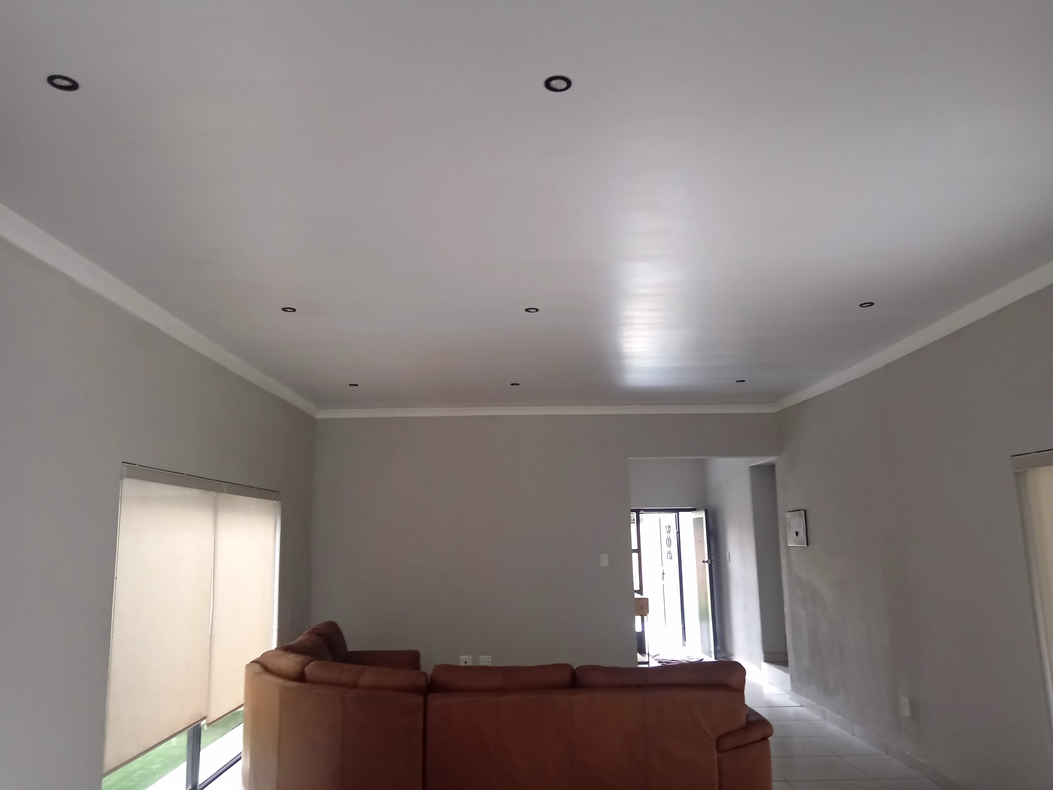 Freshly installed smooth ceiling boards in residential lounge — Centurion Gauteng