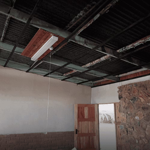 Ceiling before installation — water-damaged and deteriorated, Centurion