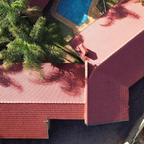 Residential roof after professional repainting — fresh uniform colour, Centurion