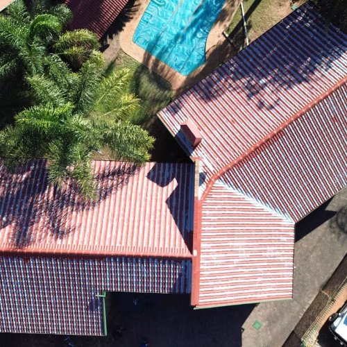 Residential roof before repainting — weathered and faded tiles, Centurion