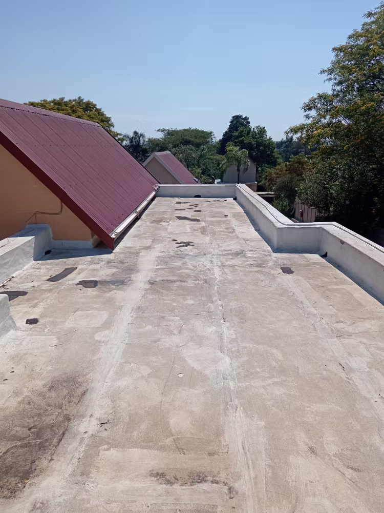Flat roof before torch-on waterproofing — deteriorated and cracked surface, Centurion