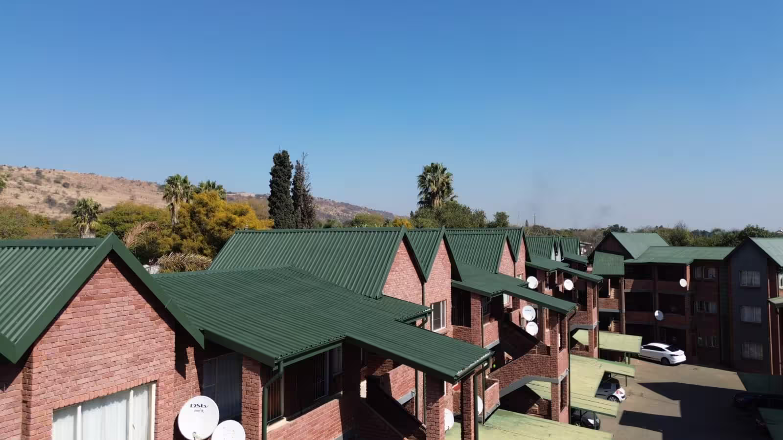 Large commercial roof complex after professional repainting — Centurion Gauteng