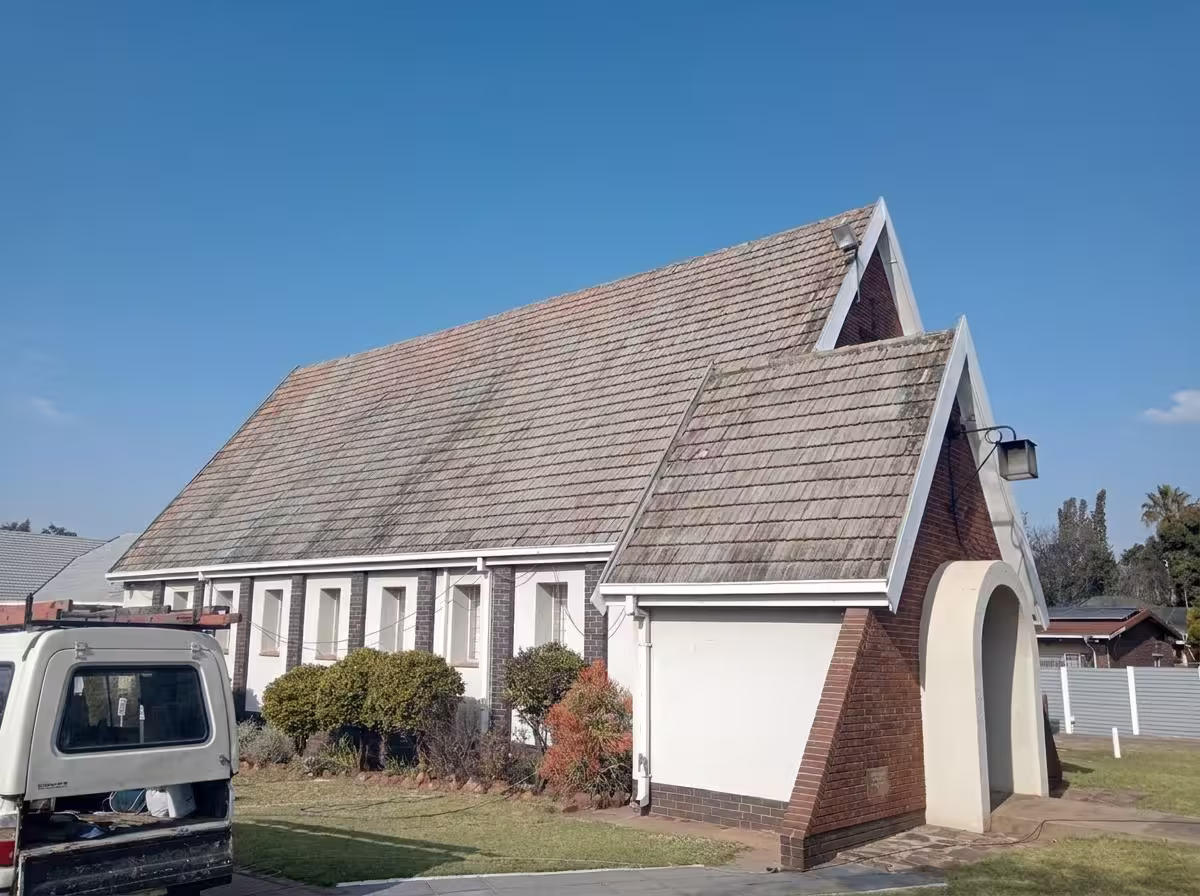 Residential home roof before painting showing weathered faded tiles — Centurion