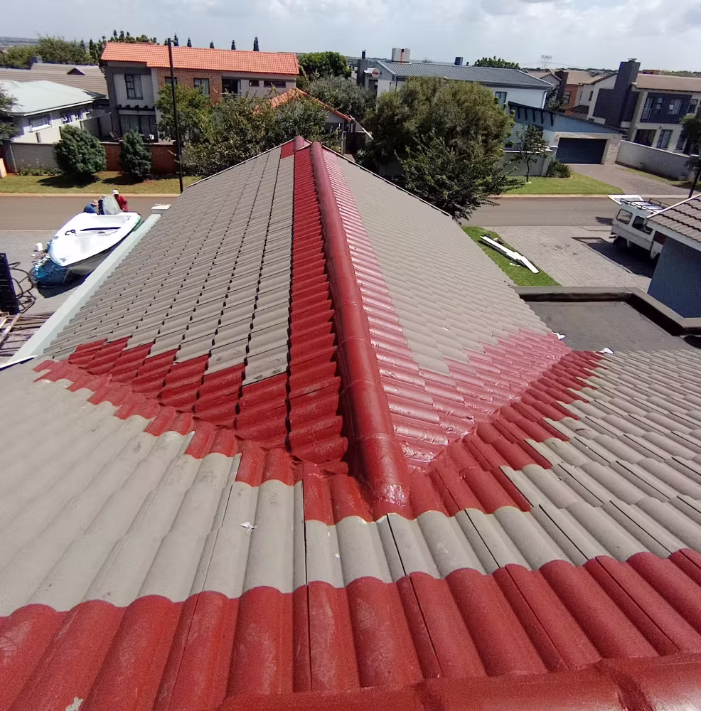 Professional waterproofing team at work on a flat roof